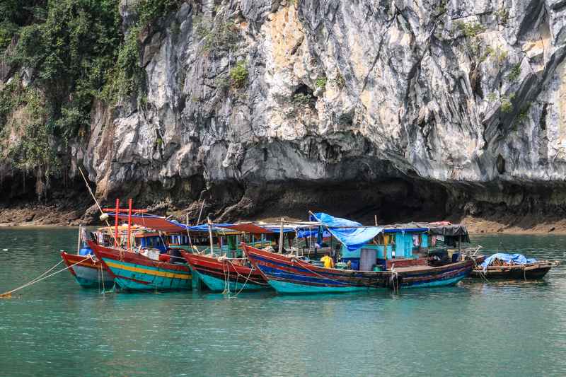Halong Bay limestone islands with boats in Vietnam